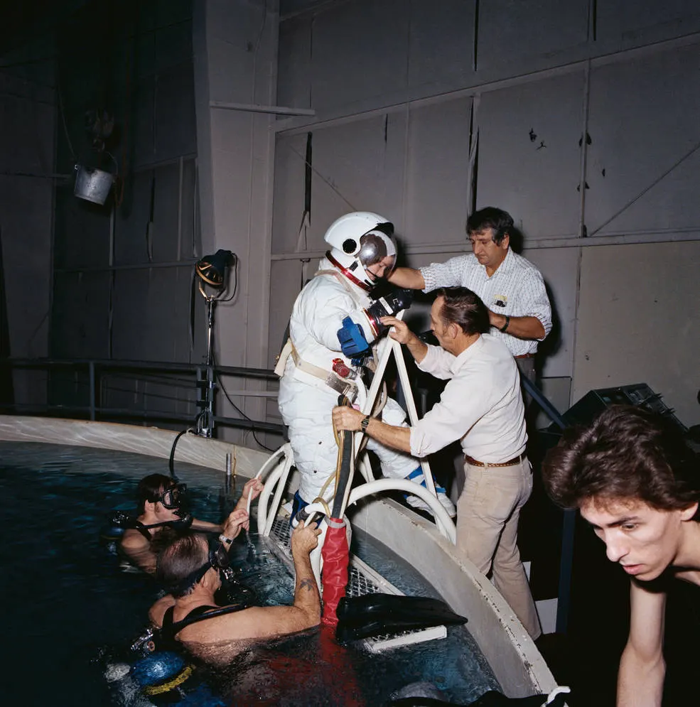 astronaut coming out of water after training