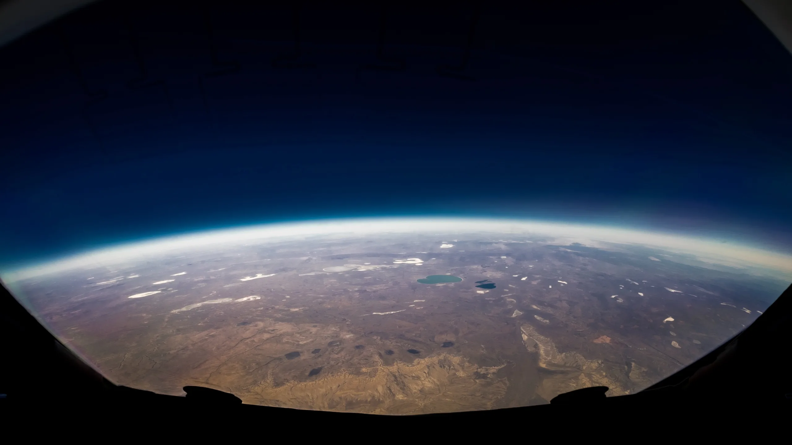 The glowing curvature of the planet seen from space